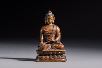 Three Tibetan bronze ritual bells and a bronze Buddha, 19th C.