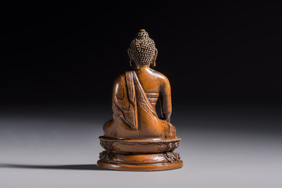 Three Tibetan bronze ritual bells and a bronze Buddha, 19th C.