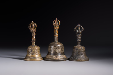 Three Tibetan bronze ritual bells and a bronze Buddha, 19th C.