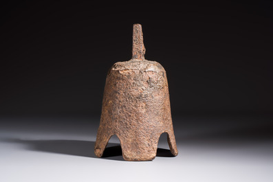 Seven various Chinese bronze and cast-iron bells, Han and later