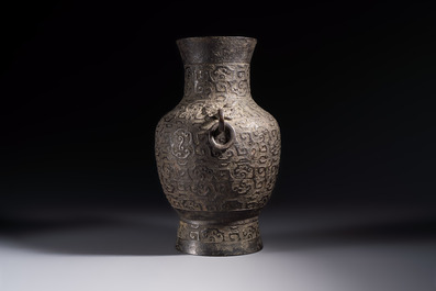 A Chinese archaistic bronze vase with Taotie handles, 'Hu 壺', Ming