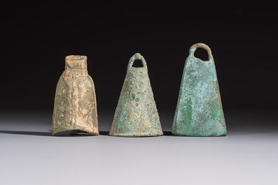 Seven various Chinese bronze and cast-iron bells, Han and later