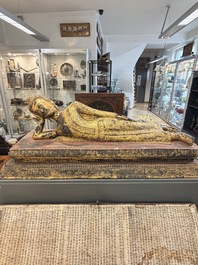An exceptional and large gilt-lacquered bronze figure of the reclining Parinirvana Buddha, Thailand, 18th C.