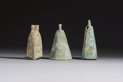 Seven various Chinese bronze and cast-iron bells, Han and later