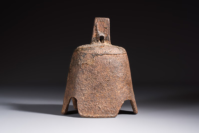 Seven various Chinese bronze and cast-iron bells, Han and later