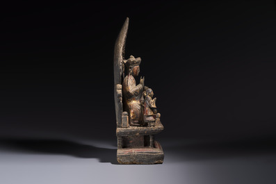 A Chinese gilt-lacquered wooden Bodhisattva and attendants on a throne, Qing