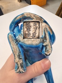 A Chinese turquoise-glazed model of a dog, Qianlong mark, 19th C.