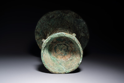 A Chinese archaic bronze ritual wine vessel with Taotie design, 'Zun 尊', Shang