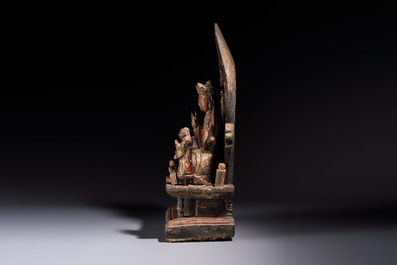 A Chinese gilt-lacquered wooden Bodhisattva and attendants on a throne, Qing