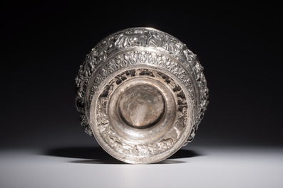 A large repouss&eacute; silver footed bowl depicting a hunting scene, India, late 19/early 20th C.