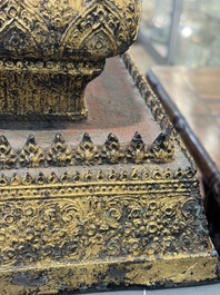 An exceptional and large gilt-lacquered bronze figure of the reclining Parinirvana Buddha, Thailand, 18th C.