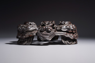 Two large Chinese carved wooden stands, 19th C.