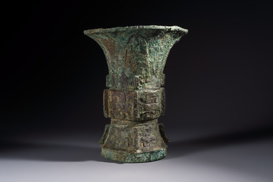 A Chinese archaic bronze ritual wine vessel with Taotie design, 'Zun 尊', Shang