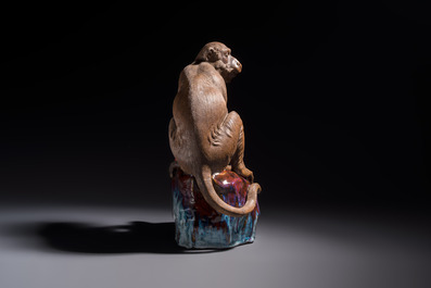 A Chinese polychrome-glazed Shiwan stoneware 'Monkey and Peach' group, signed, 20th C.