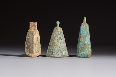 Seven various Chinese bronze and cast-iron bells, Han and later