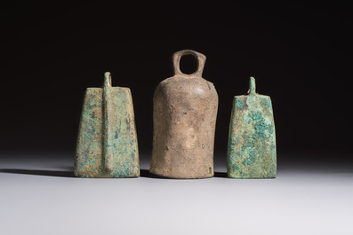 Seven various Chinese bronze and cast-iron bells, Han and later