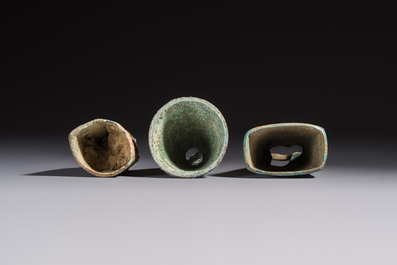 Seven various Chinese bronze and cast-iron bells, Han and later