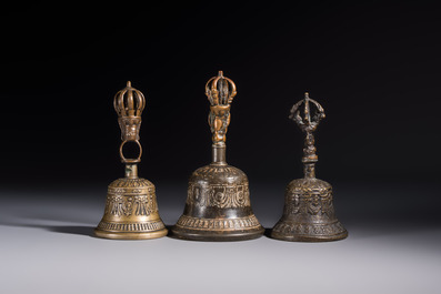 Three Tibetan bronze ritual bells and a bronze Buddha, 19th C.