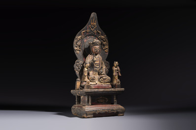 A Chinese gilt-lacquered wooden Bodhisattva and attendants on a throne, Qing