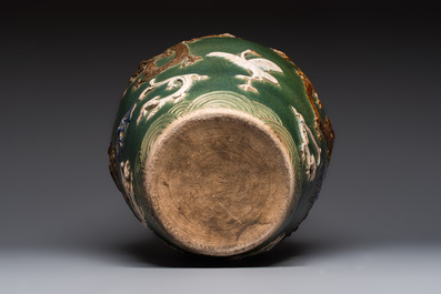 A Chinese sancai-glazed martaban with relief design, 19th C.