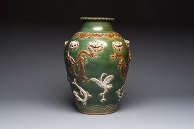 A Chinese sancai-glazed martaban with relief design, 19th C.