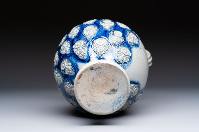 A Westerwald stoneware jug with a lion's head and moulded floral design, Germany, 17th C.