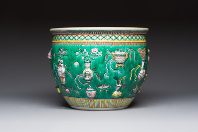 A Chinese famille rose green-ground 'Antiquities' fish bowl or jardini&egrave;re with applied relief design, 19th C.