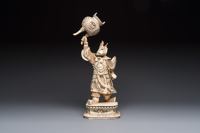 A Chinese polychromed carved bone figure of a warrior raising a tripod censer, 20th C.