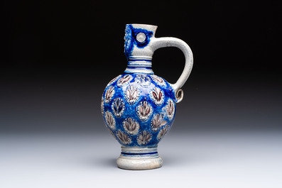 A Westerwald stoneware jug with a lion's head and moulded floral design, Germany, 17th C.