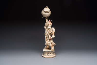 A Chinese polychromed carved bone figure of a warrior raising a tripod censer, 20th C.