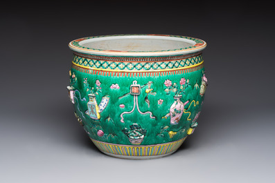 A Chinese famille rose green-ground 'Antiquities' fish bowl or jardini&egrave;re with applied relief design, 19th C.