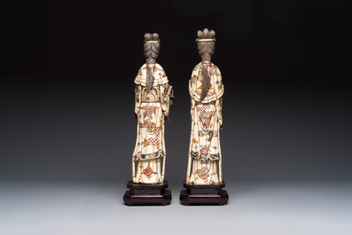 A pair of Chinese polychromed carved bone figures of divinities, 20th C.