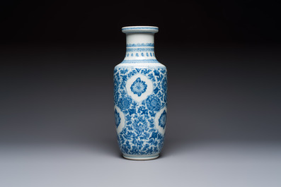 A Chinese blue and white rouleau vase with floral design, Kangxi