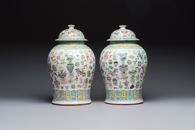 A pair of Chinese famille rose 'Antiquities' covered vases and a dish, 19th C.
