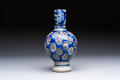 A Westerwald stoneware jug with a lion's head and moulded floral design, Germany, 17th C.