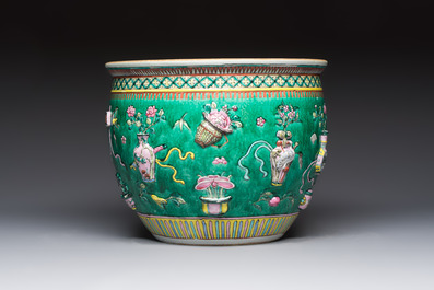 A Chinese famille rose green-ground 'Antiquities' fish bowl or jardini&egrave;re with applied relief design, 19th C.