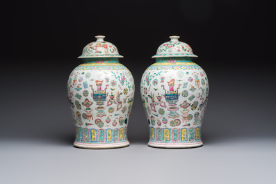 A pair of Chinese famille rose 'Antiquities' covered vases and a dish, 19th C.