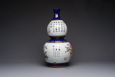 A large Chinese polychrome-decorated blue-ground double-gourd vase, 20th C.