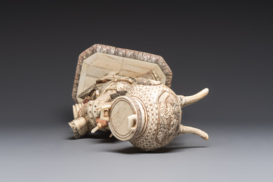 A Chinese polychromed carved bone figure of a warrior raising a tripod censer, 20th C.
