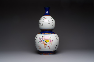 A large Chinese polychrome-decorated blue-ground double-gourd vase, 20th C.