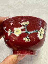 Two Chinese famille rose ruby-ground 'Landscape Scroll' cups and saucers, Yongzheng