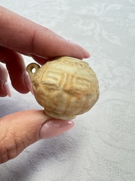 A pair of Chinese bird feeders with moulded design, one unglazed, on later wooden stands, Song