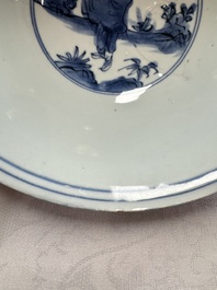 A Chinese blue and white 'Eight Immortals' bowl on a wooden stand, Chenghua mark, late Ming