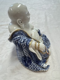 A Chinese blue and white, iron-red and gilt-decorated Milefo Buddha, Fu Jian Hui Guan 福建會館 and You Lin Ji Zhi 游林記製 marks, 20th C.