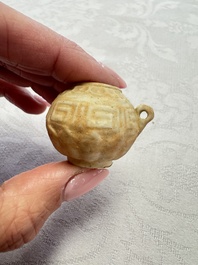 A pair of Chinese bird feeders with moulded design, one unglazed, on later wooden stands, Song