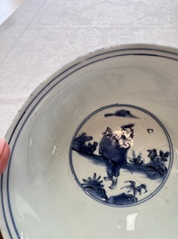 A Chinese blue and white 'Eight Immortals' bowl on a wooden stand, Chenghua mark, late Ming