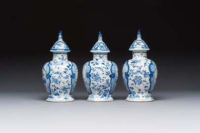 A rare Chinese blue and white five-piece garniture in Dutch Delft style, Kangxi mark, 19th C.