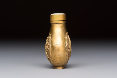 A Chinese gilt-bronze and mother-of-pearl-inlaid snuff bottle with birds among flowering branches, Guangxu mark and of the period