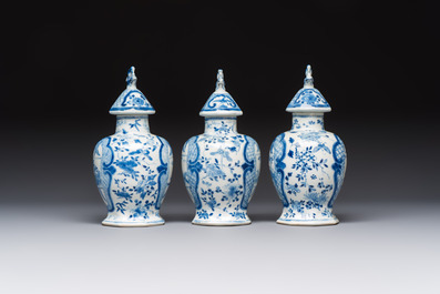 A rare Chinese blue and white five-piece garniture in Dutch Delft style, Kangxi mark, 19th C.