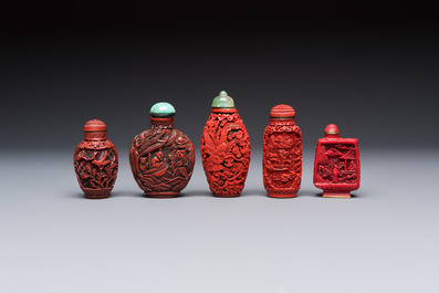 Nine Chinese cinnabar lacquer snuff bottles and a covered box, Qianlong marks, 19/20th C.